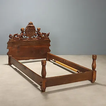 Single walnut bed with carvings, 19th century
