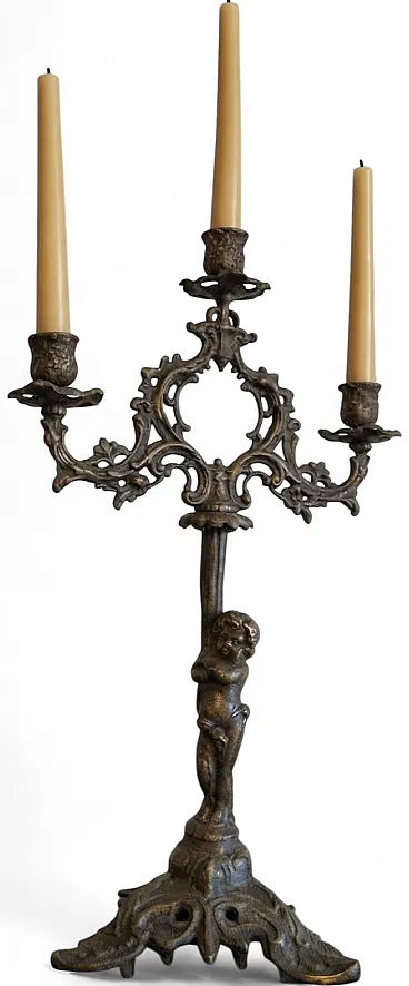 Bronze candle holder with cherub, 19th century