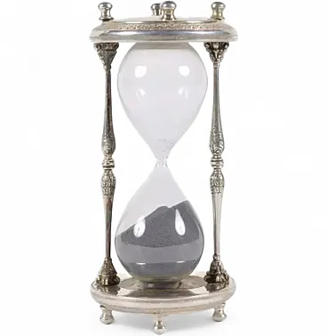 Hourglass set within a silver architectural frame, early 20th century